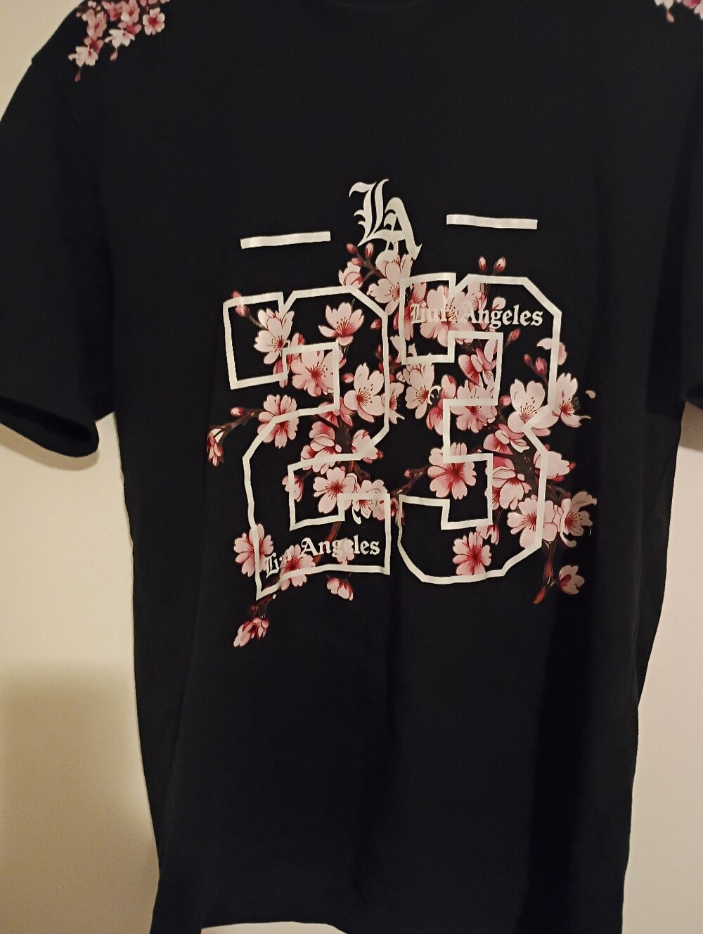 Source Unknown Black Tee with Pink Floral '23' Graphic